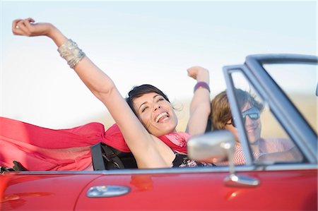 smiling in the wind with scarf - Girl dancing on the street Stock Photo - Premium Royalty-Free, Code: 649-03796273