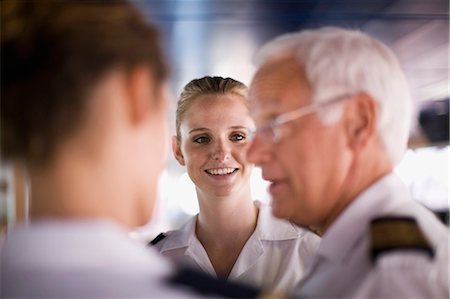 Crew of a ship talking Fotografie stock - Premium Royalty-Free, Codice: 649-03796332