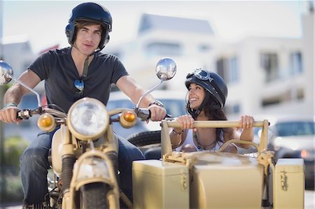 Couple riding a motorbike Stock Photo - Premium Royalty-Free, Code: 649-03796395