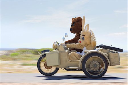 Bear and bunny riding a motorbike Stock Photo - Premium Royalty-Free, Code: 649-03796410