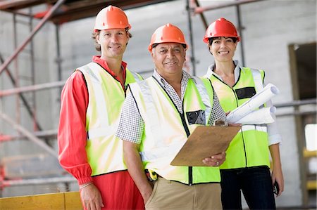 females working in hard hats - Building workers and architect Stock Photo - Premium Royalty-Free, Code: 649-03796454