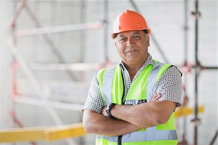 engineer standing with arms crossed - Portrait of an architect Stock Photo - Premium Royalty-Free, Code: 649-03796450