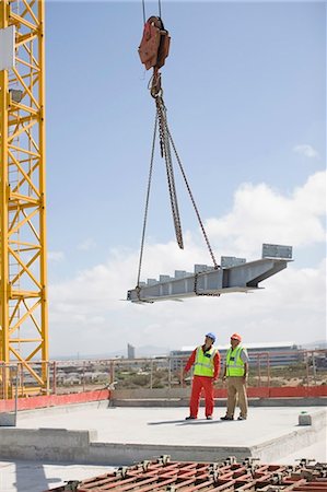 engineers inspecting at construction site - Crane and workers on construction site Stock Photo - Premium Royalty-Free, Code: 649-03796481