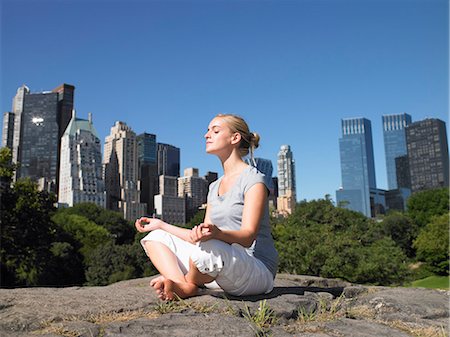 Woman doing yoga in central park Stock Photo - Premium Royalty-Free, Code: 649-03796757