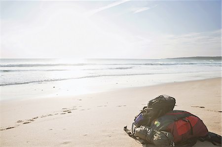 spain backpack - Two backpacks laid down on the beach Stock Photo - Premium Royalty-Free, Code: 649-03797671