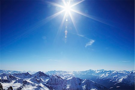 simsearch:649-07063567,k - Sun over snow covered mountains Foto de stock - Sin royalties Premium, Código: 649-03857160