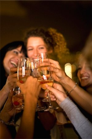 People toasting at party at night Stock Photo - Premium Royalty-Free, Code: 649-03857294