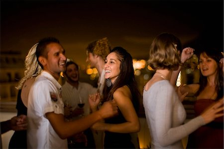 diverse group adult fun - People dancing at party at night Stock Photo - Premium Royalty-Free, Code: 649-03857304