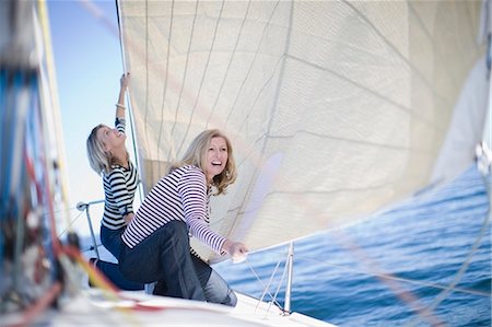 sailing crew - Women adjusting sail on boat Stock Photo - Premium Royalty-Free, Code: 649-03857326