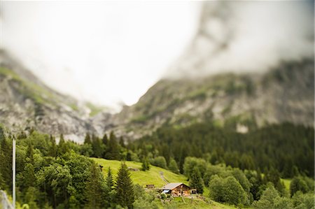 surrealism - Aerial view of house on hillside Stock Photo - Premium Royalty-Free, Code: 649-03857564