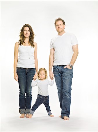 similarity father - Parents holding daughter's hand Stock Photo - Premium Royalty-Free, Code: 649-03857604