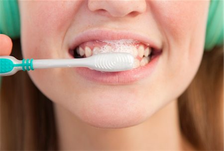 simsearch:649-05556276,k - Close up of girl brushing her teeth Stock Photo - Premium Royalty-Free, Code: 649-03857853