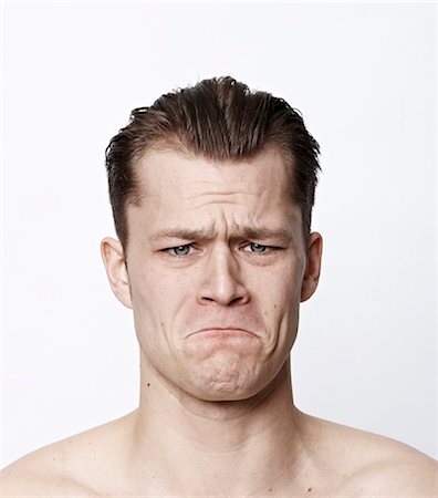 sad portraits - Nude man frowning Stock Photo - Premium Royalty-Free, Code: 649-03858022