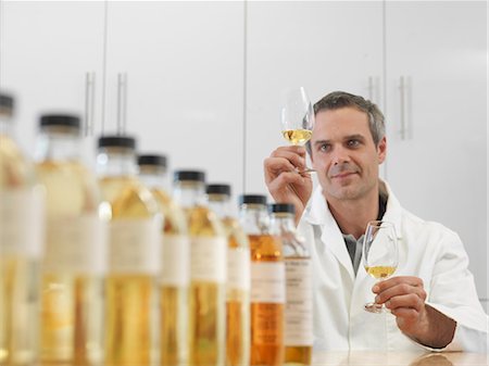 expert (male) - Scientist tasting whisky in plant Stock Photo - Premium Royalty-Free, Code: 649-03858228