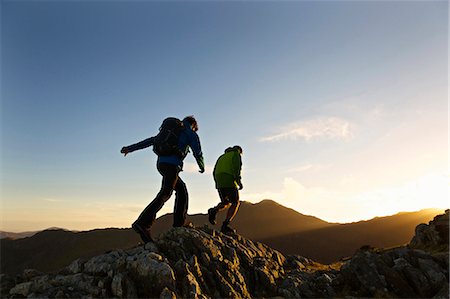 peak - Men hiking on rocky mountainside Stock Photo - Premium Royalty-Free, Code: 649-03858389