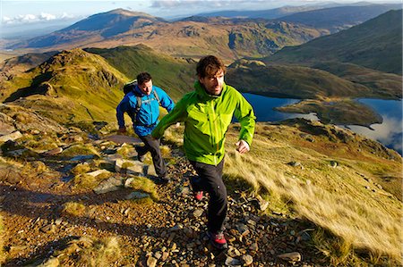 friends travel - Men hiking on rocky mountainside Stock Photo - Premium Royalty-Free, Code: 649-03858383