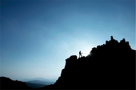 success mountain - Man hiking on rocky hillside Stock Photo - Premium Royalty-Free, Code: 649-03858399