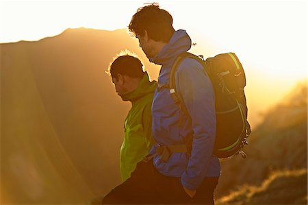 simsearch:6128-08738356,k - Men hiking on mountainside Stock Photo - Premium Royalty-Free, Code: 649-03858390