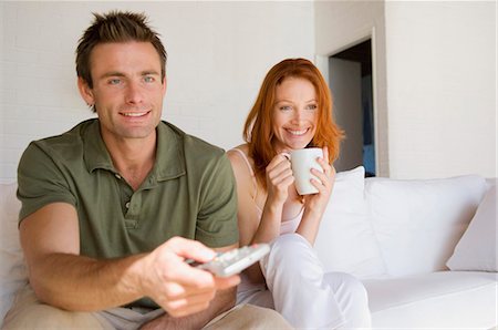 simsearch:6109-06003128,k - Couple watching television together Stock Photo - Premium Royalty-Free, Code: 649-03884350