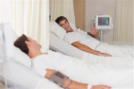 sick men in hospital bed - Patients talking in hospital beds Stock Photo - Premium Royalty-Free, Code: 649-03881616