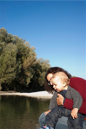 simsearch:640-05761238,k - Mother holding baby by creek Stock Photo - Premium Royalty-Free, Code: 649-03881878