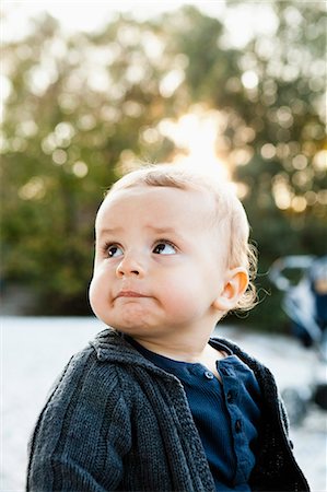 Scared baby sitting outdoors Stock Photo - Premium Royalty-Free, Code: 649-03881886