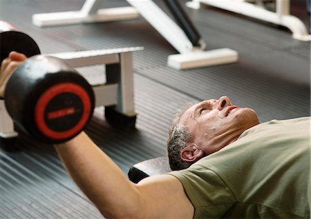 Man lifting weights at gym Stock Photo - Premium Royalty-Free, Code: 649-03881974