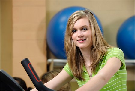 Woman using elliptical machine Stock Photo - Premium Royalty-Free, Code: 649-03882012