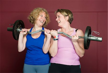 friends women indoors happy middle aged - Older women lifting weights in gym Stock Photo - Premium Royalty-Free, Code: 649-03882021