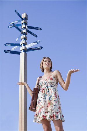 Confused woman at crossroads Stock Photo - Premium Royalty-Free, Code: 649-03882342