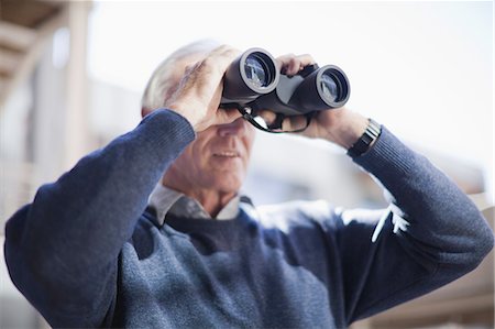 Businessman looking through binoculars Stock Photo - Premium Royalty-Free, Code: 649-03882496