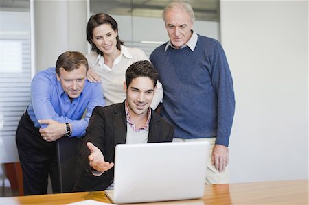 simsearch:649-03817904,k - Business people using laptop in office Stock Photo - Premium Royalty-Free, Code: 649-03882501