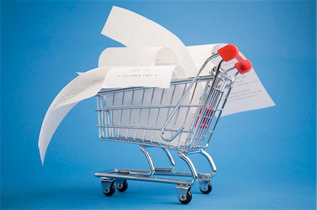 spending - Receipts in shopping cart Stock Photo - Premium Royalty-Free, Code: 649-03883416