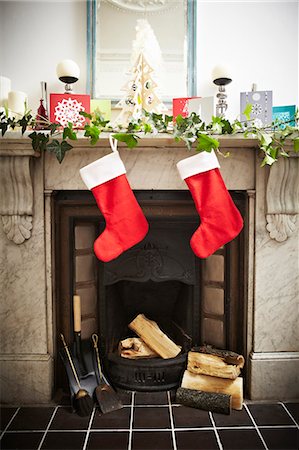 Christmas stockings hung on fireplace Stock Photo - Premium Royalty-Free, Code: 649-03883652