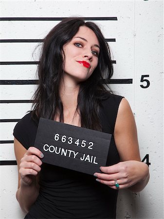 female in jail - Studio photo de jeune femme Photographie de stock - Premium Libres de Droits, Code: 640-05760904