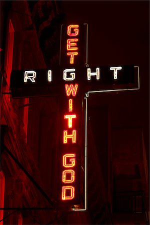 UK, London, Illuminated neon cross with massage Stock Photo - Premium Royalty-Free, Code: 640-05760928