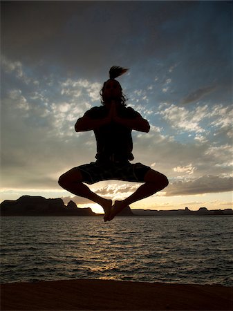 USA, Utah, Young man jumping by Lake Powell Stock Photo - Premium Royalty-Free, Code: 640-05761035