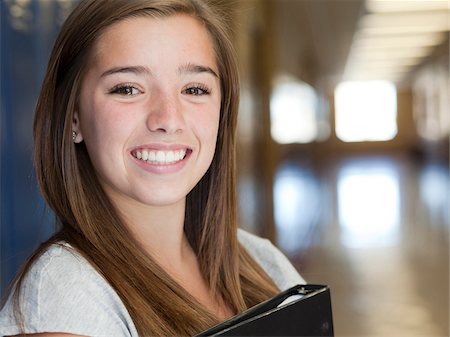 USA, Utah, Spanish Fork, Portrait of school girl (16-17) holding file in corridor Stock Photo - Premium Royalty-Free, Code: 640-05761056