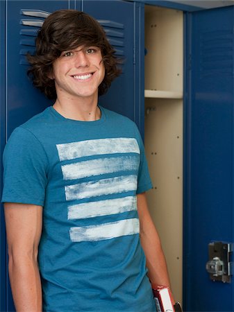 USA, Utah, Spanish Fork, Portrait of school boy standing by lockers Stock Photo - Premium Royalty-Free, Code: 640-05761083