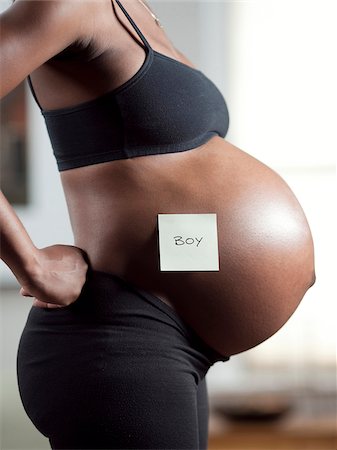 USA, Utah, Orem, Pregnant woman with adhesive note on belly Stock Photo - Premium Royalty-Free, Code: 640-05761104