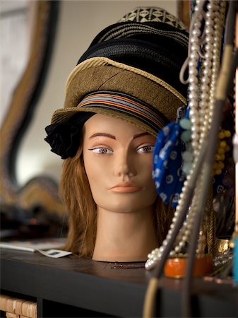 USA, Utah, Provo, Mannequin head displaying hats with jewelry Stock Photo - Premium Royalty-Free, Code: 640-05761183