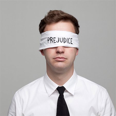 single word - Studio portrait of young man with blindfold Stock Photo - Premium Royalty-Free, Code: 640-05761244