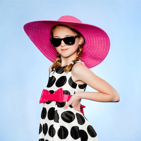 studio kid fashion - Studio portrait of elegant girl (10-11) wearing hat, sunglasses and dress Stock Photo - Premium Royalty-Free, Code: 640-05761292