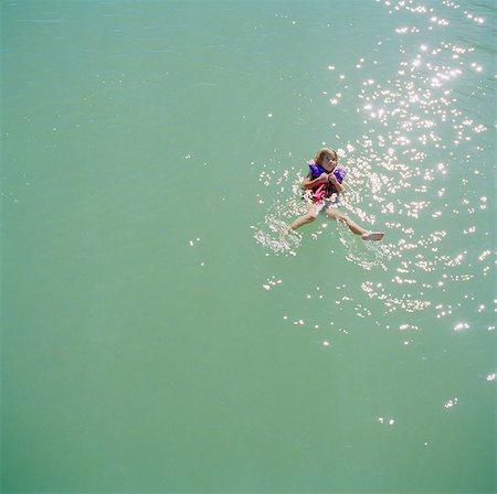 USA, Utah, Lake Powell, Girl (6-7) floating on water Stock Photo - Premium Royalty-Free, Code: 640-05761366