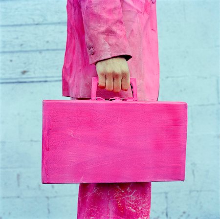 pink white close up - USA, Utah, Salt Lake City, Man in pink suit holding pink briefcase, midsection Stock Photo - Premium Royalty-Free, Code: 640-05761363