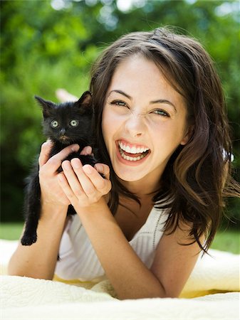 people holding kittens - USA, Utah, Orem, Portrait of woman holding kitten Stock Photo - Premium Royalty-Free, Code: 640-05761410