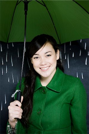 person and raincoat and umbrella - woman in a chalkboard rainstorm Stock Photo - Premium Royalty-Free, Code: 640-06049791