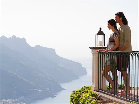 Italy, Ravello, Young couple on balcony overlooking coast Stock Photo - Premium Royalty-Free, Code: 640-06049888