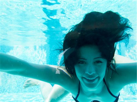 sunlight underwater - Italy, Ravello, Underwater portrait of swimming woman Stock Photo - Premium Royalty-Free, Code: 640-06049958