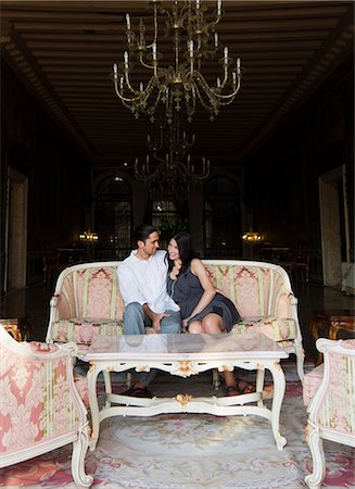 Italy, Venice, Young couple sitting together in luxury room Stock Photo - Premium Royalty-Free, Code: 640-06050000